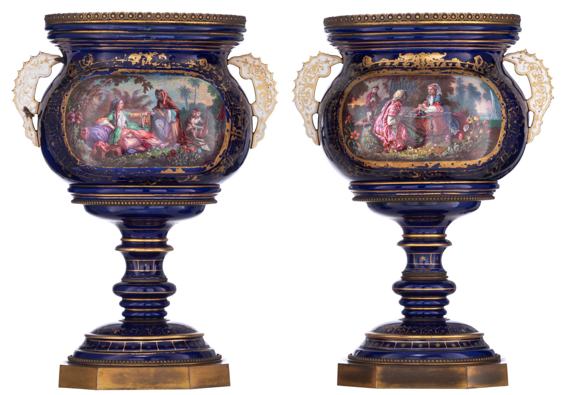 A pair of bleu royale ground SŠvres vases with brass mounts, the roundels polychrome decorated with