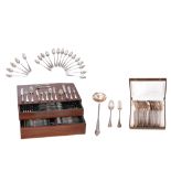 A silver cutlery set, containing twelve forks and twelve soup spoons, in a matching box, marked Delh