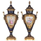 A pair of covered bleu royale ground SŠvres type vases with Neoclassical gilt bronze mounts, the rou