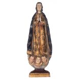 A gilt and polychrome painted sculpture of the standing Madonna on three angel heads, decorated with