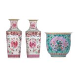 A pair of Chinese famille rose floral decorated vases, the roundels decorated with peony blossoms -