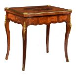 A fine mahogany and rosewood veneered fold-over games table, decorated with gilt bronze mounts and t