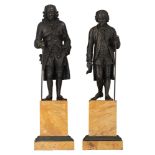 A pair of patinated bronze sculptures of Voltaire and Rousseau, after J.A. Houdon, on a Sienna marbl