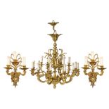 A set of an imposing gilt bronze Neoclassical chandelier and a pair of wall lights, decorated with c