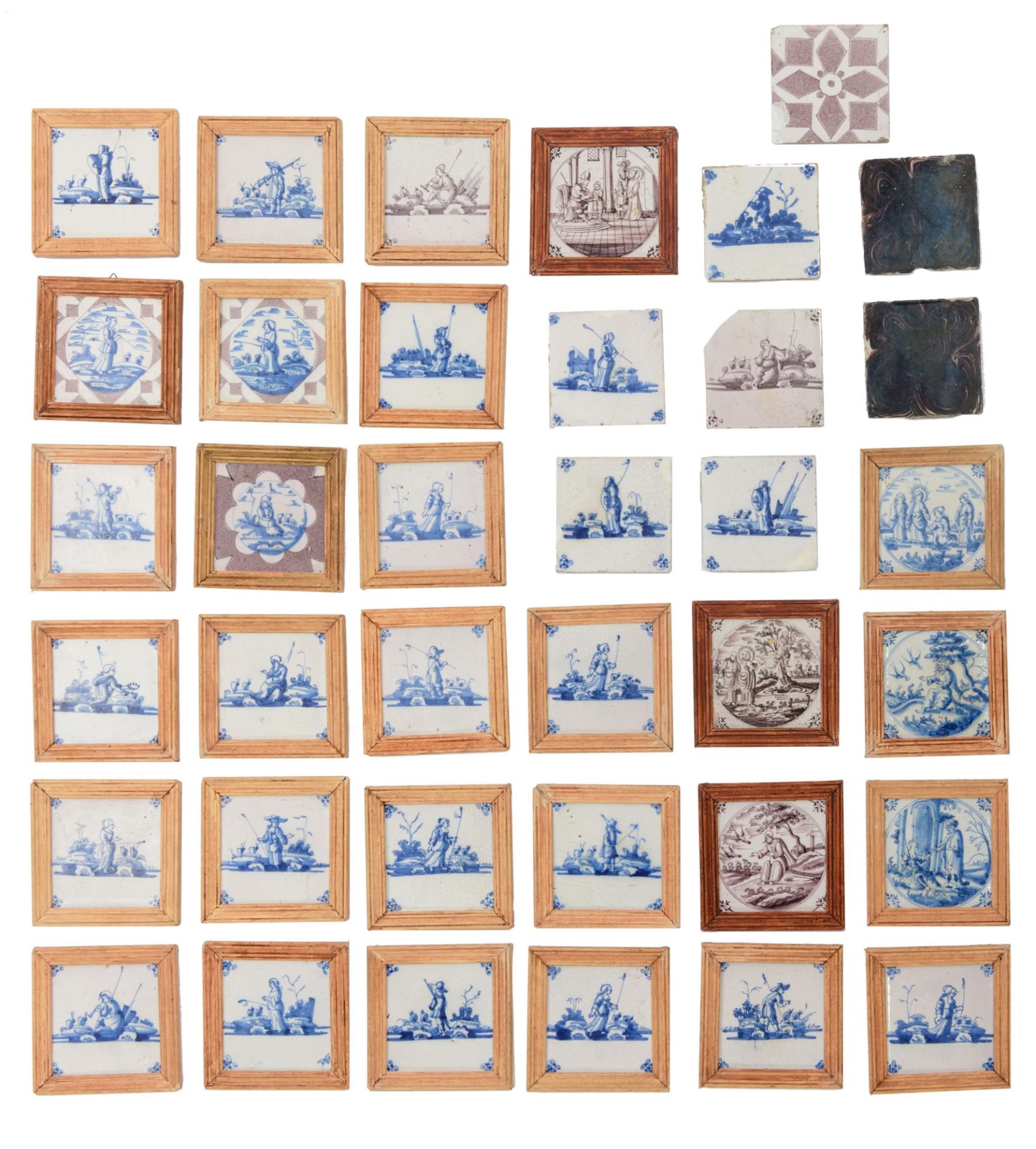 A large collection of 25 blue and white and manganese decorated Dutch Delftware tiles, depicting sev