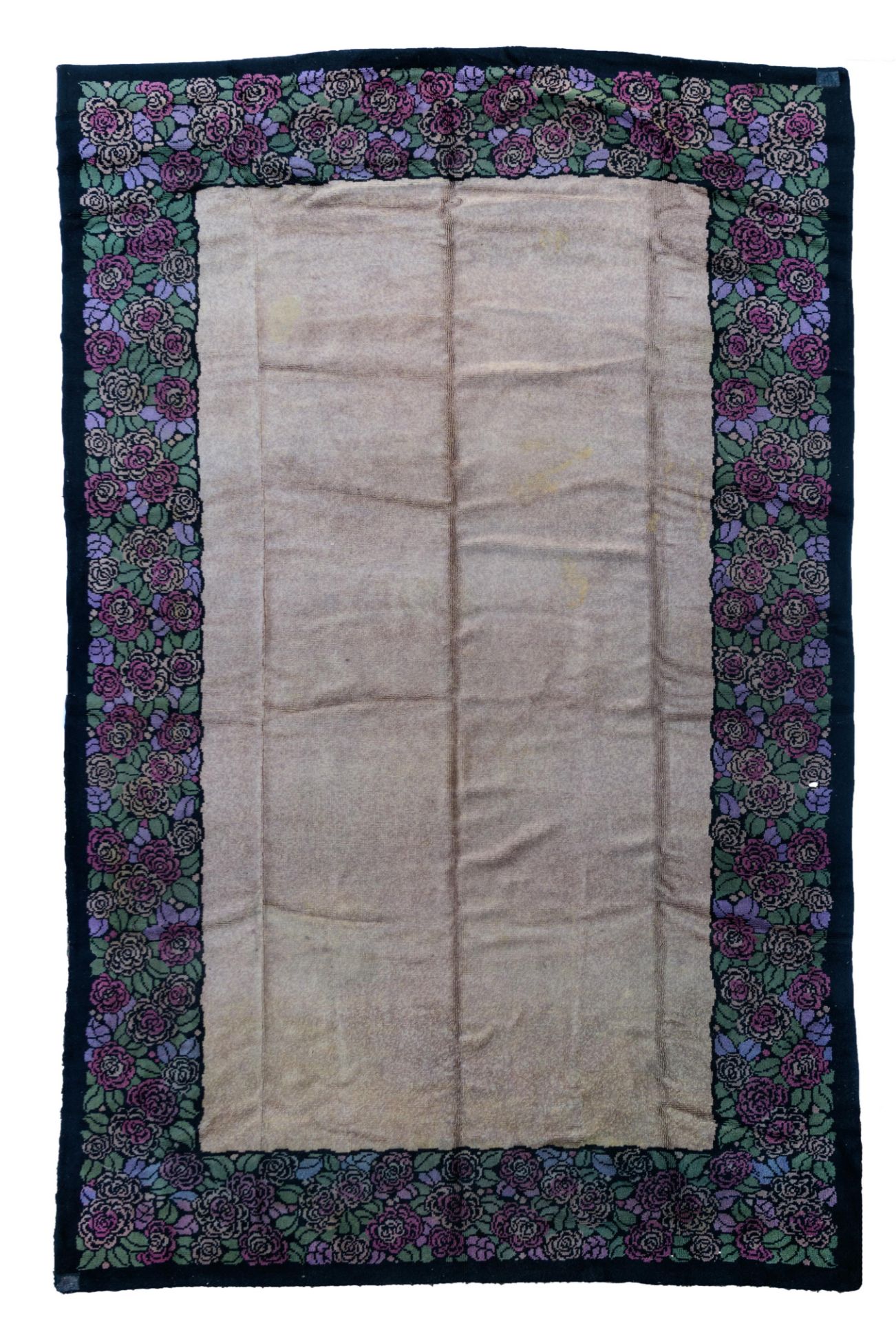 An Art Deco rug, decorated with a floral border, woollen, 310 x 490 cm
