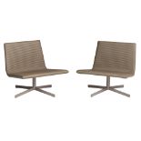 A pair of elephant-grey leather lounge chairs of the 'VVD collection', design by Vincent Van Duysen
