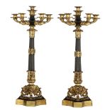 A pair of Neoclassical gilt and patinated bronze candlesticks, H 62 cm