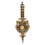 A Napoleon III period gilt bronze cartel clock, decorated with volutes and lion heads, the dial flan