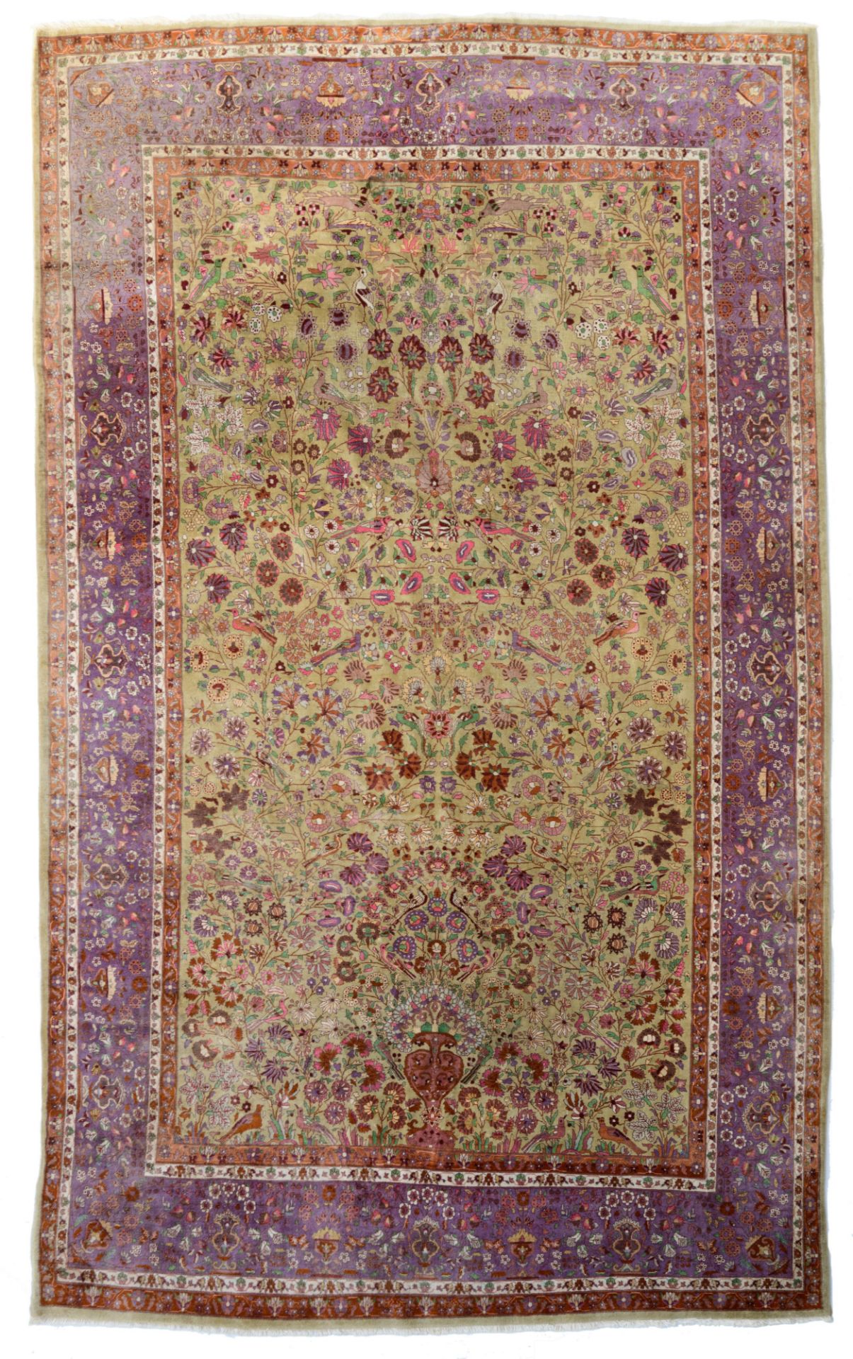 An Oriental rug, decorated with a flower vase and birds on flower branches, 223 x 362 cm
