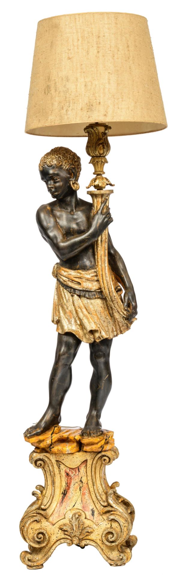 A polychrome and gilt painted blackamoor figure, holding a lamp, H 140 - 173 - W 35 cm
