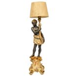 A polychrome and gilt painted blackamoor figure, holding a lamp, H 140 - 173 - W 35 cm