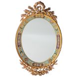 A Louis XVI style gilt brass mirror, decorated with a floral decorated champlev‚ rim, 30 x 48 cm