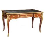 A rosewood veneered Louis XV style 'bureau plat', decorated with parquetry, gilt bronze mounts and l