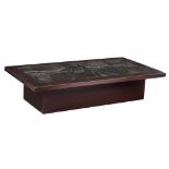 A vintage coffee table with a black glazed ceramic relief top by Deforche E., monogrammed E.D., and