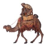 A cold painted plaster Arab on his camel, in the manner of Franz Bergman, Vienna, H 46 - W 47 cm