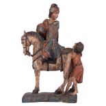 An oak sculpture of Saint Martin, with traces of polychrome paint, 16thC, H 72 - W 46 cm