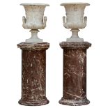 A very finely sculpted pair of Carrara marble Medici vases, abundantly decorated with acanthus leave