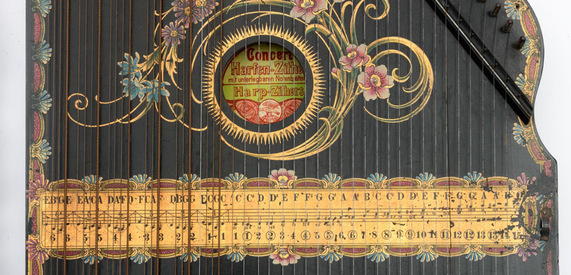 A belle ‚poque ebonised German 'harp-zither', decorated with a hand-painted eagle and Art Nouveau fl - Image 5 of 10