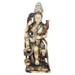 A Chinese polychrome painted ivory seated Guanyin figure accompanied by a F“-lion, late Qing-period,