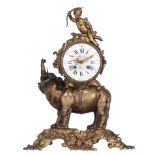 A patinated bronze mantle clock, with an elephant carrying the clock on his back with on top a cupid