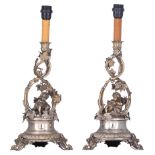 A pair of Belle poque (German?) silver-plated candelabras decorated with Bacchus putti as an allego