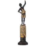 A Venetian type polychrome painted and gilt wooden blackamoor torchŠre figure, dressed in an elabora