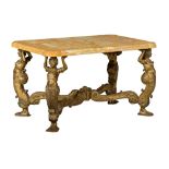 A Baroque style gilt wooden centre table with a yellow Sienna marble top, resting on four caryatides