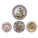 A collection of three large plates in the manner of the Italian Renaissance Maiolica, the wells deco
