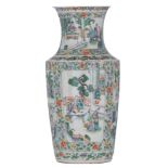 A Chinese floral decorated famille verte vase, the panels decorated with scenes from the daily life,