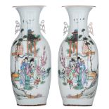 A pair of Chinese Qianjiang cai vases, decorated with playing children in a garden setting, the back