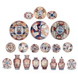 Six Japanese Imari floral decorated vases and four ditto chargers, the panels decorated with various