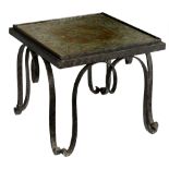 A wrought iron coffee table with a 'verre ‚glomis‚' table top, decorated with Neoclassical motifs, H