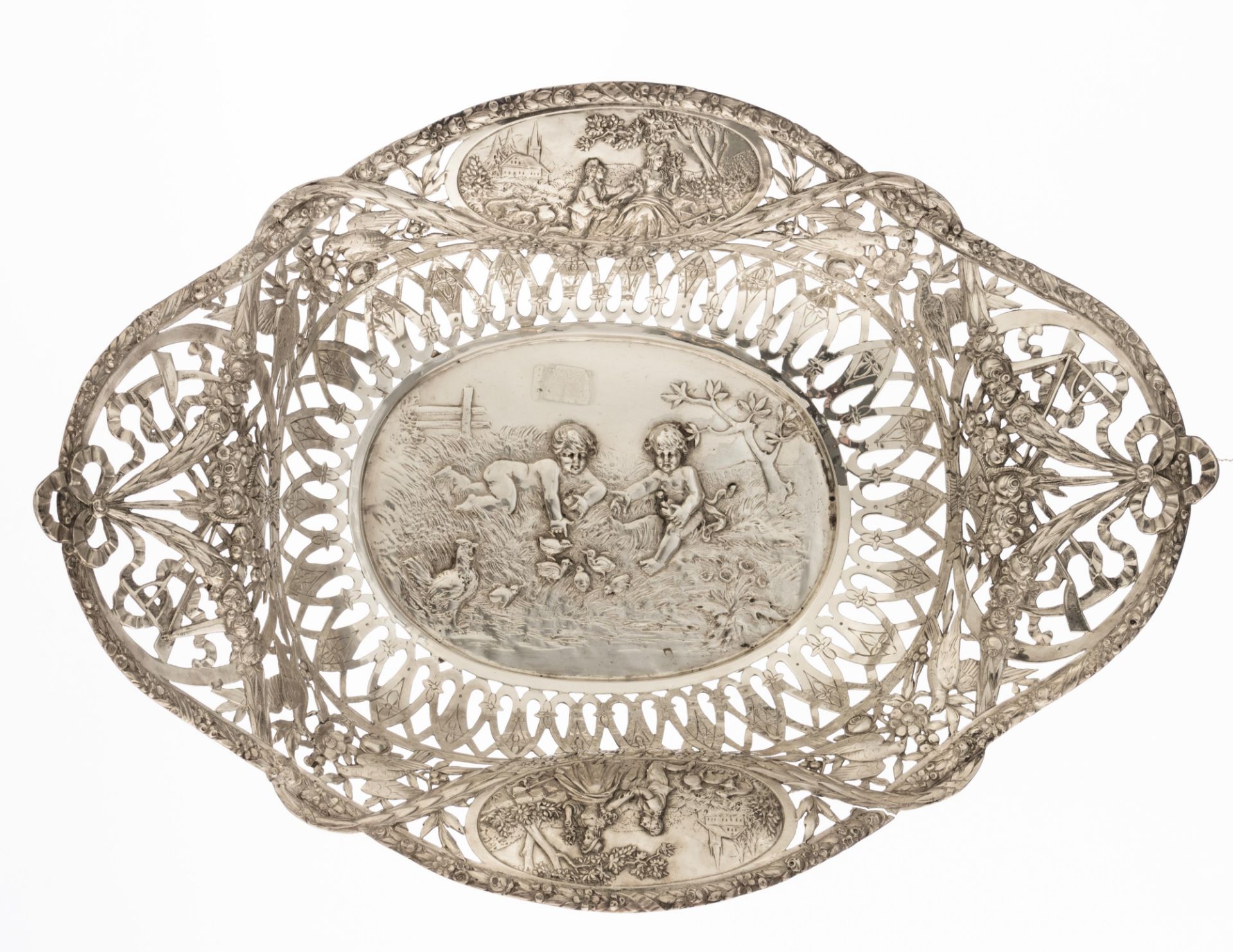 A collection of three silver chargers with ornate repousse pierced work, the well depicting playing - Bild 4 aus 12