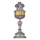 A Neoclassical silver and gilt silver ciborium with an openworked cover, the roundels decorated with