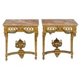 A fine pair of richly carved and gilt wooden Louis XVI period wall consoles, decorated with acanthus