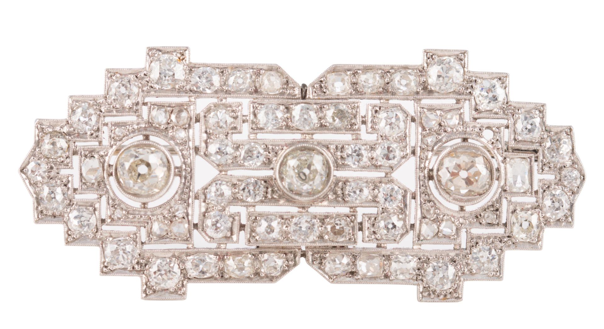 An 18ct white gold Art Deco style brooch set central with three bigger brilliant-cut diamonds and fu