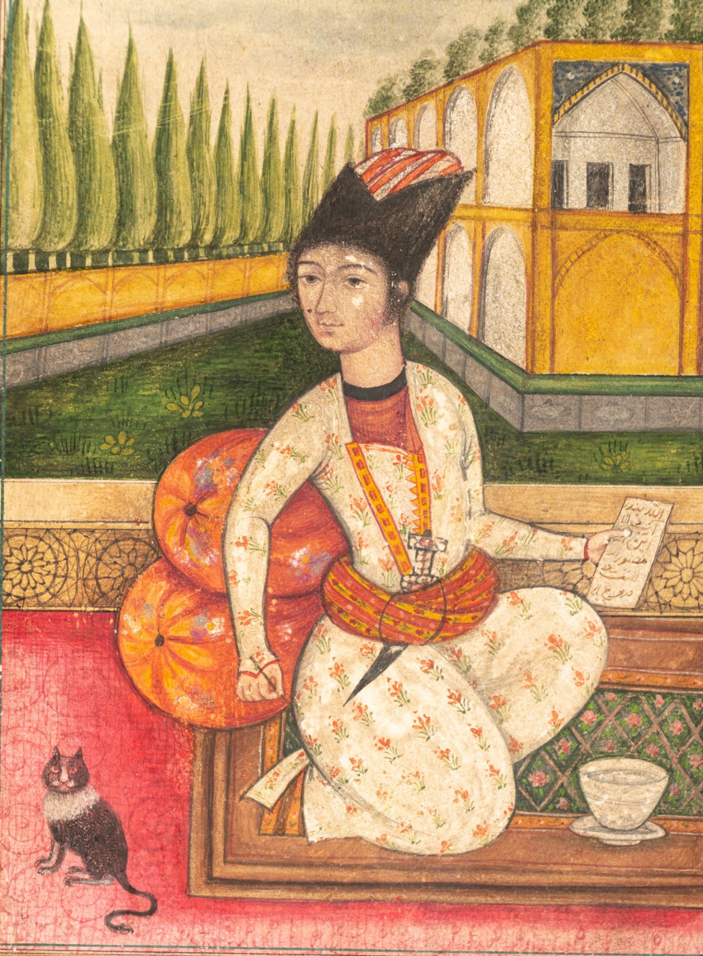A Persian 19thC gouache painting on paper depicting an elegantly dressed Qajar youth holding a pen a - Image 3 of 5