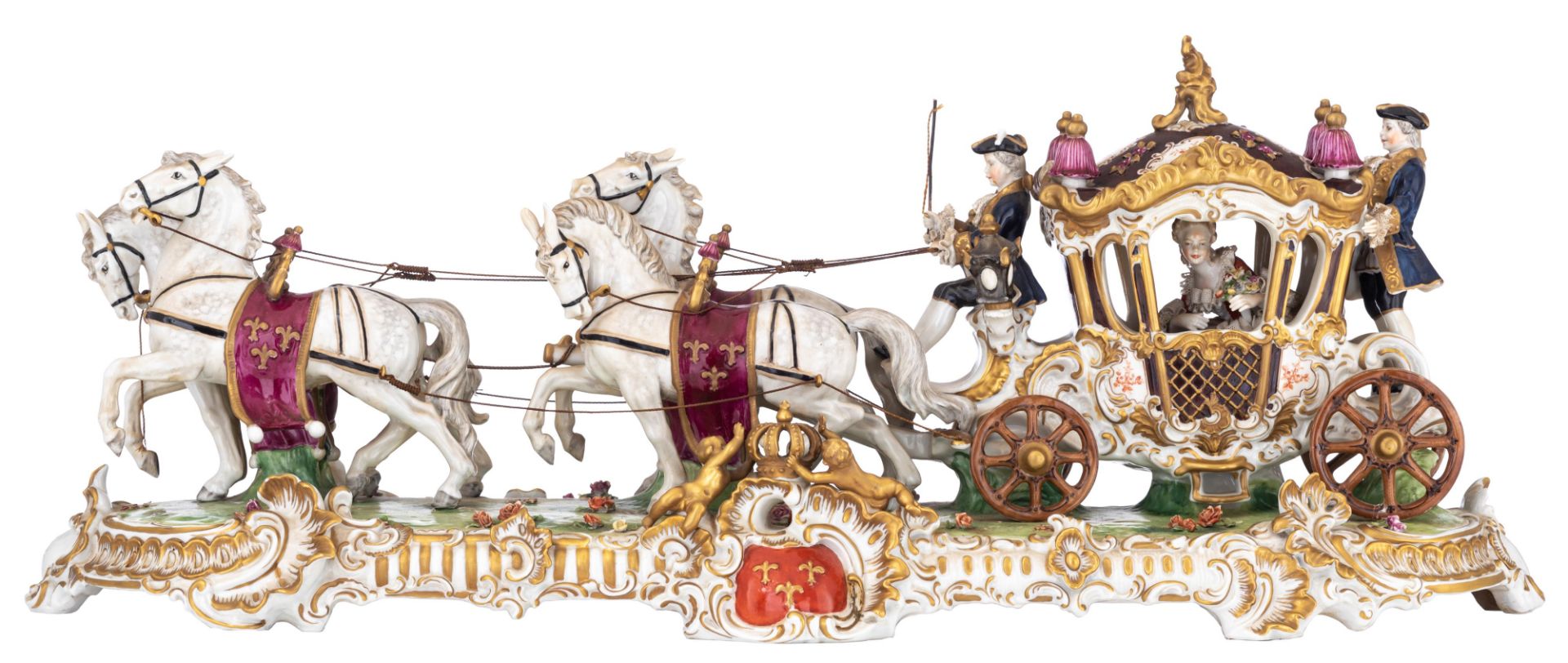 A polychrome and gilt decorated Saxony porcelain group depicting the bridal carriage, marked 'Unter