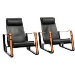 A pair of 'Cit‚' armchairs, design by Jean Prouv‚ for Cassina, black leather and cognac leather armr