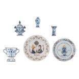 A collection of blue and white decorated Dutch Delftware items, consisting of a trophy vase, a small