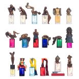 A series of 18 Les Beaux Arts perfume bottles with patinated bronze sculptures, design by various ar