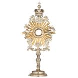 An 18th/19thC silver sunburst/solar monstrance finely wrought with baroque style features, the alter