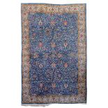 An Oriental rug, decorated with floral motifs, woollen, 223 x 335 cm