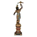 A Venetian polychrome painted and gilt wooden blackamoor torchŠre figure, dressed in an elaborately