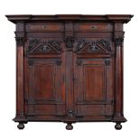 An imposing North German Baroque walnut 'Schrank', richly carved with sea Gods surrounded by angels,