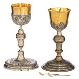 Two 19thC neoclassical relief decorated silver and gilt silver chalices: one weighing c. 612 g - H 2