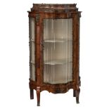 A fine mahogany veneered Rococo style display cabinet, decorated with bronze mounts and the inside w