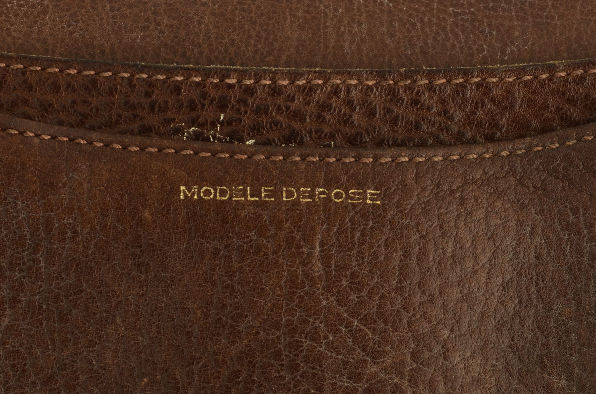 A collection of four brown leather handbags and two bleu leather handbags by Delvaux