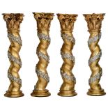 A set of four large Italian Baroque style carved, gilt and silvered wooden Solomonic columns, decora